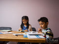 Siblings doing homework