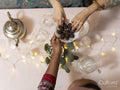 High angle view of women reaching for snack on plate