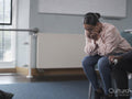 Woman crying in group therapy session