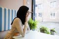 Young woman in hijab sitting in cafe