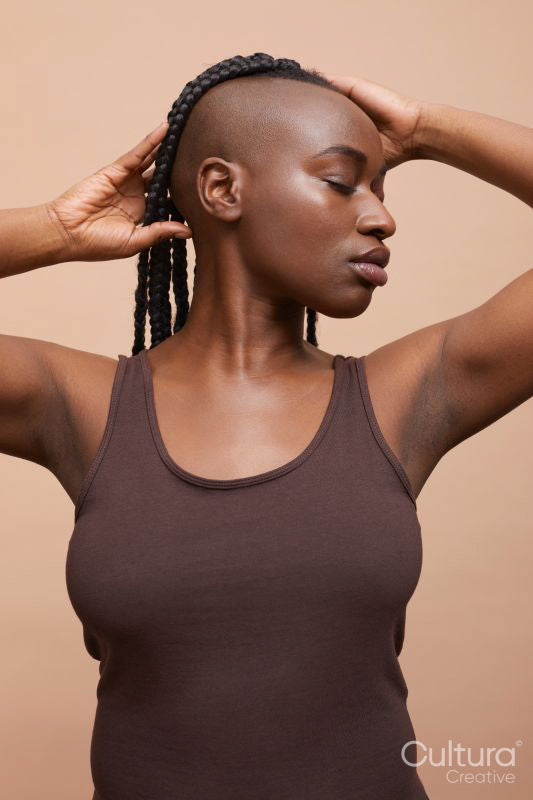 Profile portrait of beautiful woman with mohawk hair