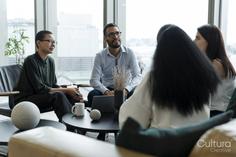 Business people having meeting in office lobby