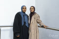 Portrait of two young women wearing hijabs