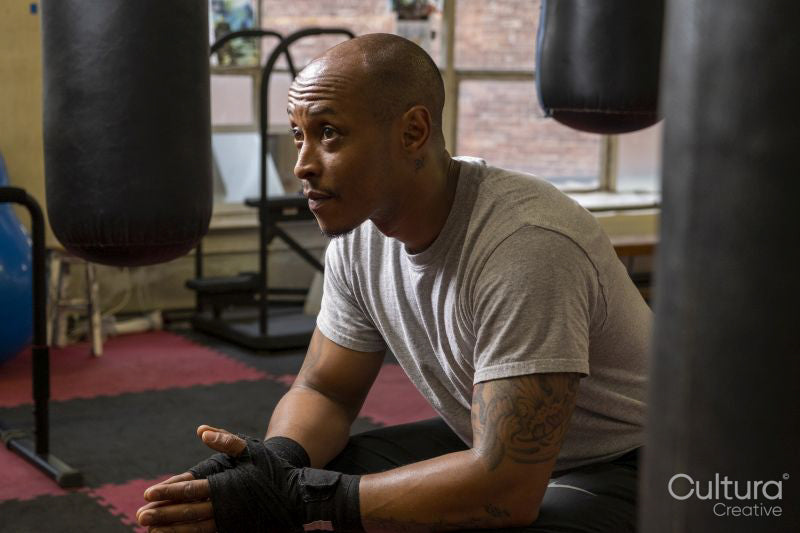 Mature man sitting in gym