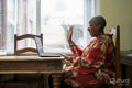 Mature woman using laptop at home