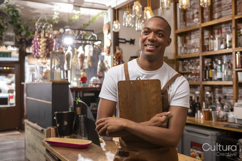 Portrait of smiling cafe owner