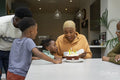 Family with children celebrating birthday at home