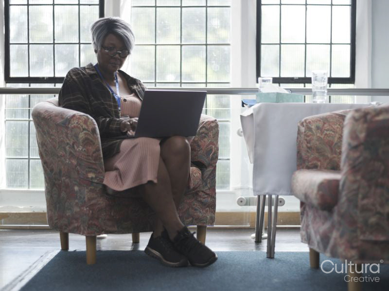 Therapist using laptop in office