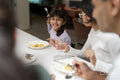 Family dining at home in evening