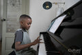 Boy playing piano