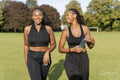 Young female friends walking in park after exercising