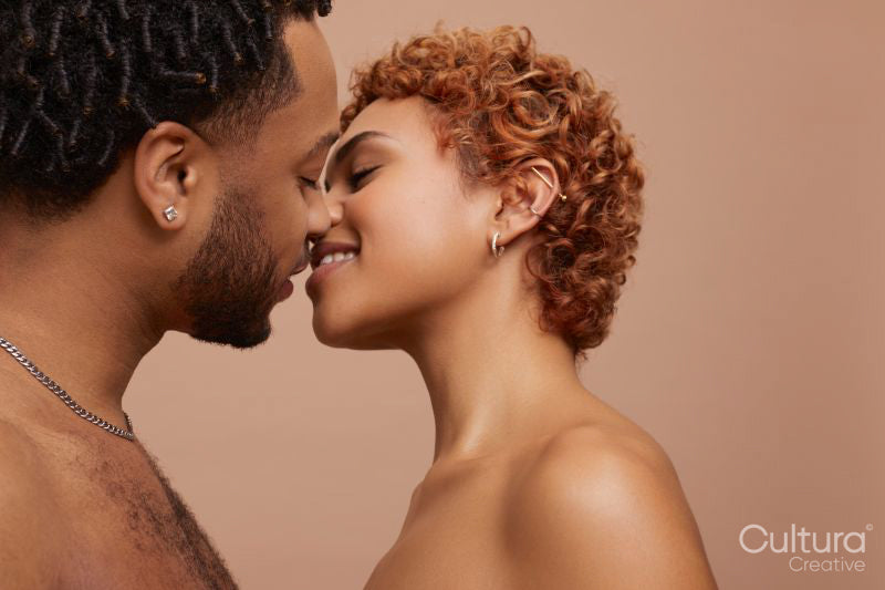 Studio portrait of happy young couple