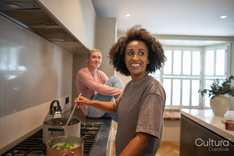 Smiling couple cooking together at home
