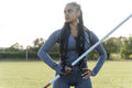 Portrait of confident female athlete holding javelin