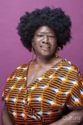 Studio portrait of mature woman with big hair