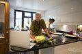 Senior couple cooking together in kitchen