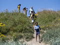 Family with children going to beach