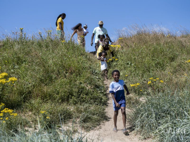 Family with children going to beach