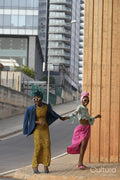 Fashion shot of couple standing in urban street