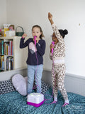 Girl friends singing at home