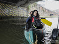 Young women canoeing with dog