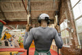 Rear view of woman exercising at gym