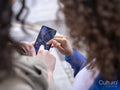 Close-up of two women looking at map on smart phone