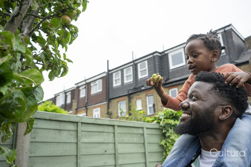 Father giving daughter piggyback ride
