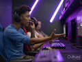 Friends playing video games in gaming club