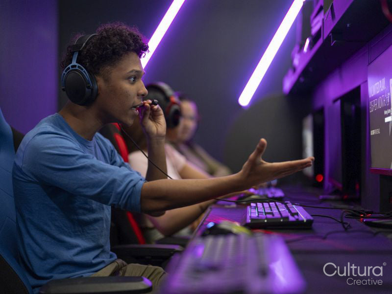 Friends playing video games in gaming club