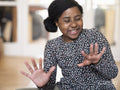 Smiling girl looking at fingernails