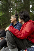 Mother and son relaxing in forest