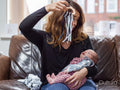 Mother playing with infant daughter