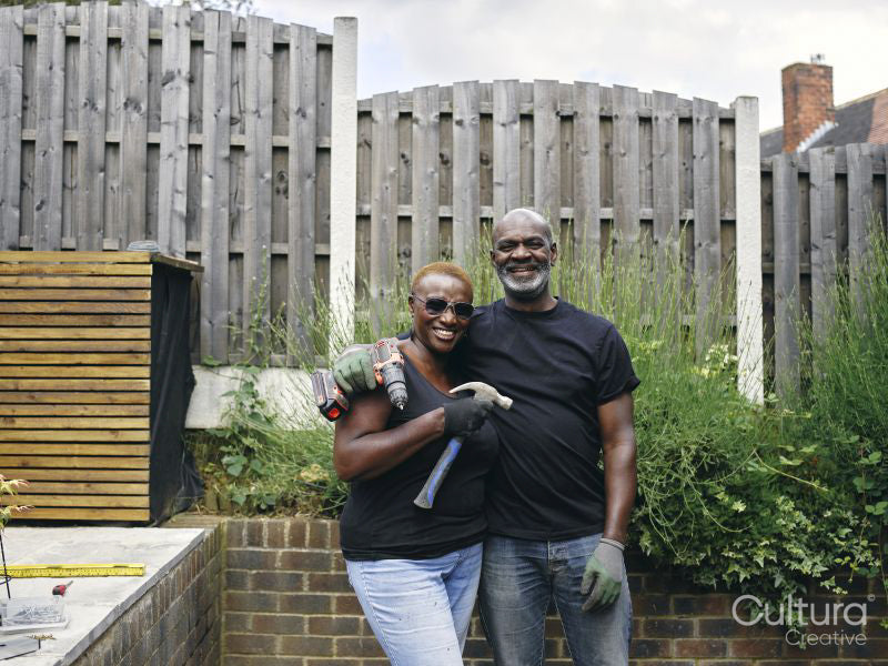 Couple with construction tools on patio