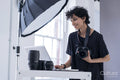 Female photographer using laptop