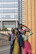 Fashion portrait of four people in urban street
