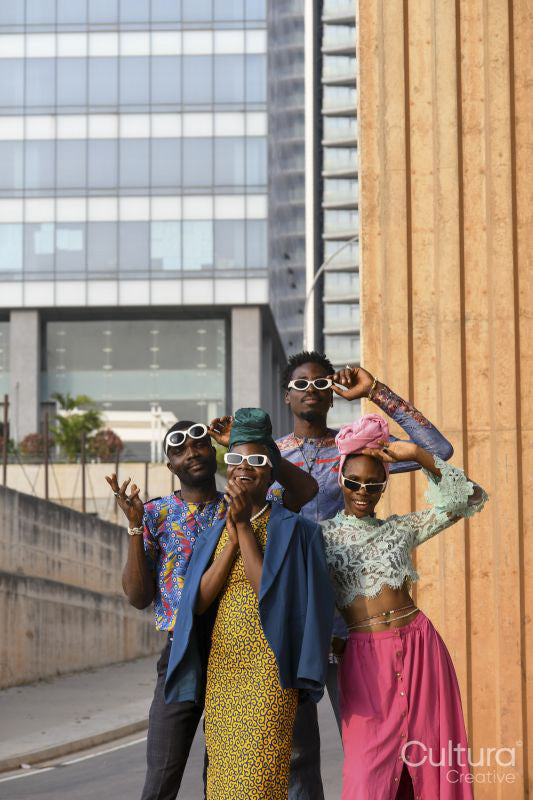 Fashion portrait of four people in urban street