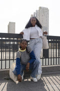 Portrait of young stylish women standing in city
