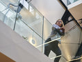 Low angle view of disabled woman in office corridor