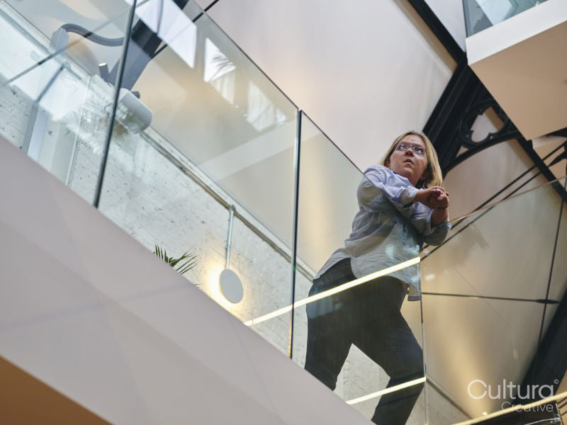 Low angle view of disabled woman in office corridor
