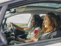 Smiling man and woman in car