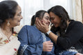 Family portrait with a young woman with down syndrome smiling at home
