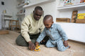 Father with Down syndrome playing with son