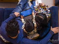 Father and children playing on digital tablet