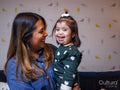 Smiling mother holding daughter