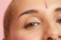 Close up of young woman with decoration on forehead