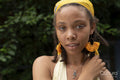 Portrait of young woman looking at camera in garden