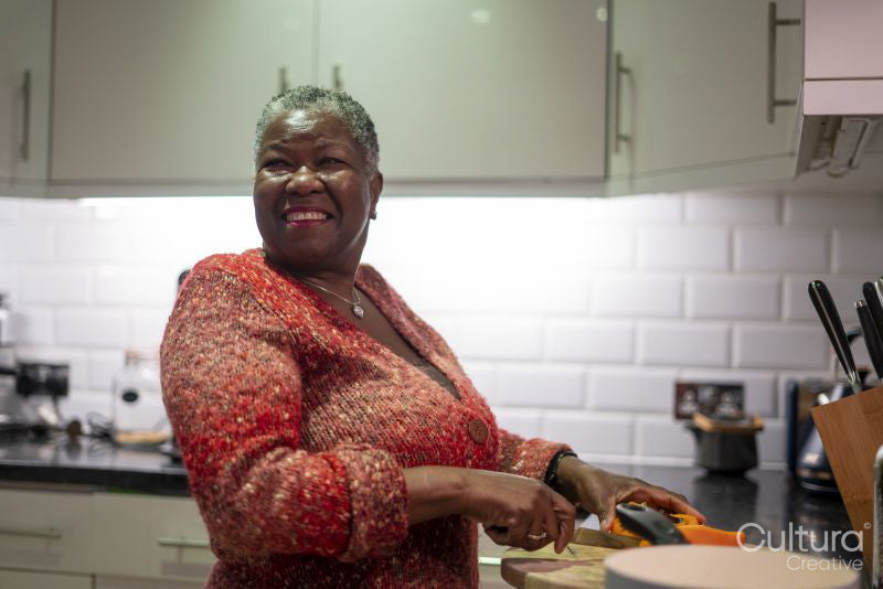 Senior woman preparing food in kitchen