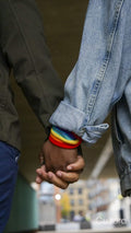 Two women holding hands, close up