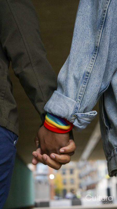 Two women holding hands, close up
